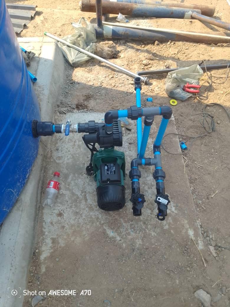 Plumber working with pipes